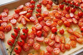 Add cherry tomatoes and season with salt and pepper to taste