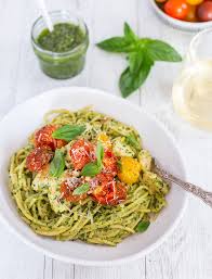 Drain pasta and return to pot. Stir in pesto and cherry tomatoes