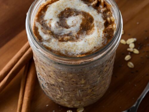 In a mason jar or container combine the rolled oats almond milk Greek yogurt chia seeds honey cinnamon and a pinch of salt